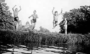 The Japics Historic Image Collection: Boys jumping into a stream