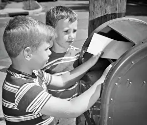 Mailing: Two Boys Mailing Letter in Mailbox