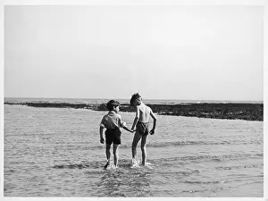 Paddle: BOYS PADDLING IN SEA