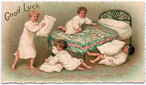 Bedspread: Four boys pillow fighting on a Good Luck card
