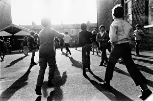 Flaring: Boys play in a primary school playground