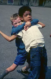 Tackling: Two boys in the playground at a Kilburn school