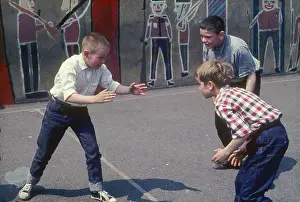 Johnsroger: Three boys in the playground at a Kilburn school