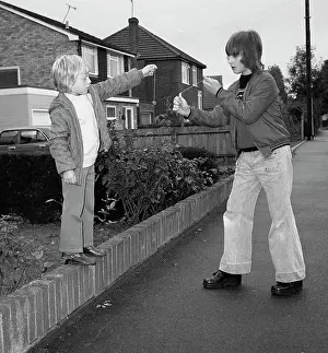 Anorak: Two boys playing conkers