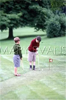 Sandles: BOYS PLAYING GOLF 1940S
