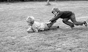 Tony Boxallfrps: Two boys playing on the grass