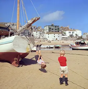 Teeshirts: Two boys playing in the harbour, St Ives, Cornwall