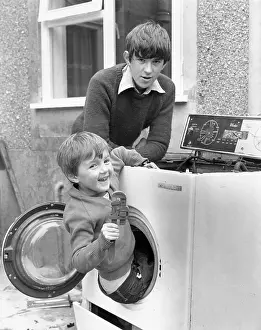 Plumber: Two boys playing in old washing machine