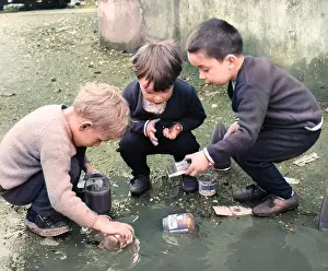 Gerber: Boys playing in a puddle, Balham, SW London