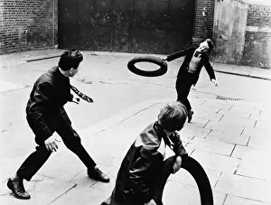 Classroger: Boys playing with tyres