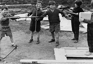Wasteland: Five boys playing on waste ground