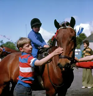 Teeshirt: Boys with a pony at a street party