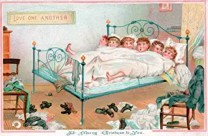 Cramped: Six boys sharing a bed on a Christmas card