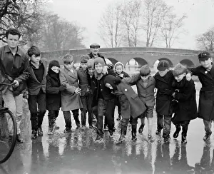 Puddles: Boys splash in water, North Cray, Sidcup