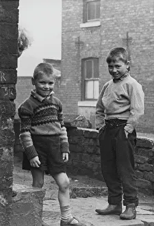 Crewcut: Two boys in a street