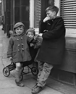 Duffel: Three boys on a street