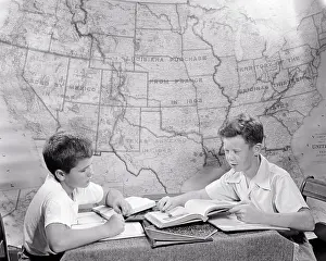 Tutoring: Two Boys Studying together Doing Homework at Table