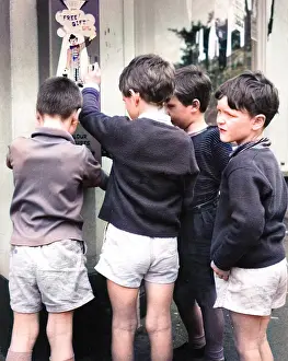 Vending: Boys using bubble gum machine, Balham, SW London