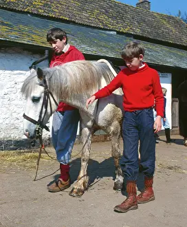 Trekking: Two boys with white pony, Horner, Somerset