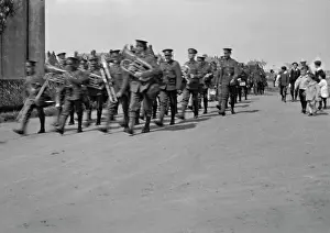 Brass band marching along a road
