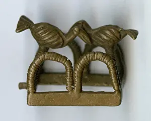 Overlapping: Brass ornament, two birds