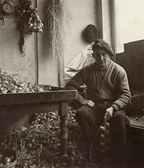 Storehouse: Breton onion seller stringing onions