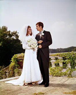 Tuxedos: Bride and Groom Standing Side by Side She in Long