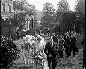 Bridesmaids: Bride and Groom Walking Through Gardens Of