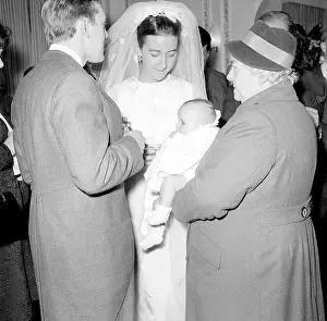 Yateman: A bride holding a baby at the reception