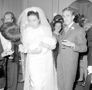 Yateman: A bride holding a baby at the reception