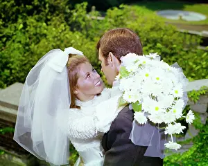 Gerber: Bride Looking up into Groom's Face Smiling Arms