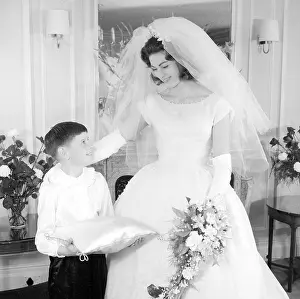 Veils: A bride and page boy at a wedding