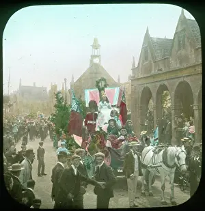 Float: Britannia's float passing the Market Hall, Chipping Capmden