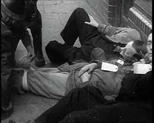 Assisting: British Air Raid Wardens Attending A Phoney