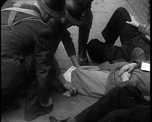 Assisting: British Air Raid Wardens Attending A Phoney