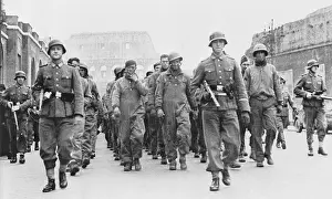 Beachhead: British and American prisoners of war marching