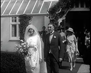 Exiting: British Bride and Groom Exiting A Building