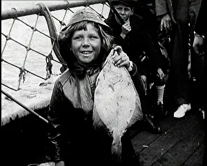 British Pathé Ltd: British Child Smiling at the Camera As She