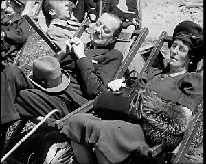 Knee: A British Couple Asleep in Deckchairs in the