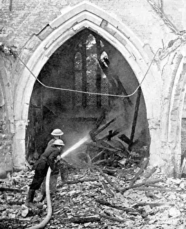 Bombs: British fire-fighters damping down smouldering