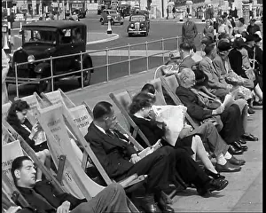 Deckchairs: British Holidaymakers Sitting on Deckchairs