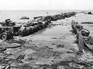 Fore: British lorries on the beach at Dunkirk, 1940