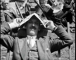 Deckchair: A British Man in a Three Piece Suit Sitting