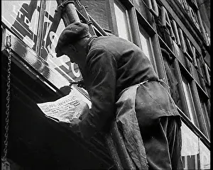 Announcing: British Man Reading Newspapers Announcing the
