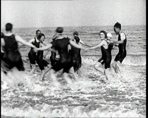 British Pathé Ltd: British People Dancing and Waving in the Sea