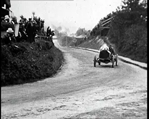 Speeding: British Racing Car Speeding Around A Corner