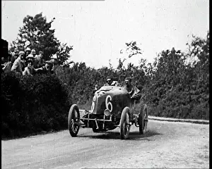 Speeding: British Racing Car Speeding Around A Corner