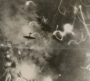 Firebombing: British RAF bomber and trails of light from incendiary