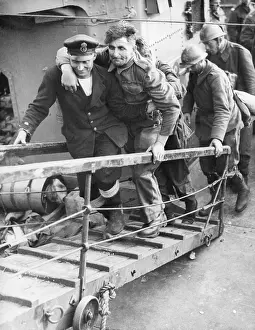 Evacuations: A British sailor assisting a wounded Tommy, WW2