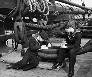 Olden: Two British sailors writing letters on a ship